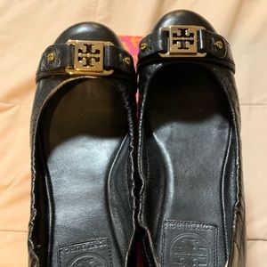 Tory Burch black leather ballerina flats.